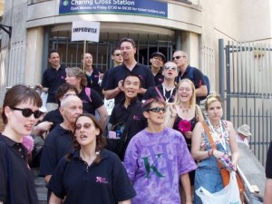 A group of Pink Singers outside Charing Cross station